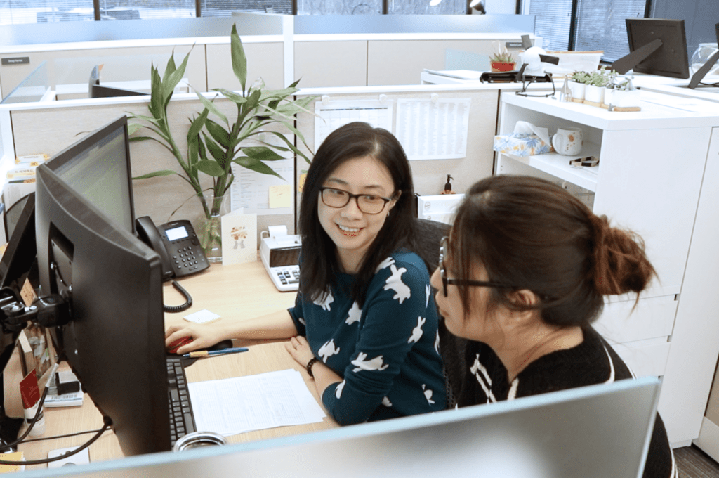 Two female Hajoca employees working together at a desk