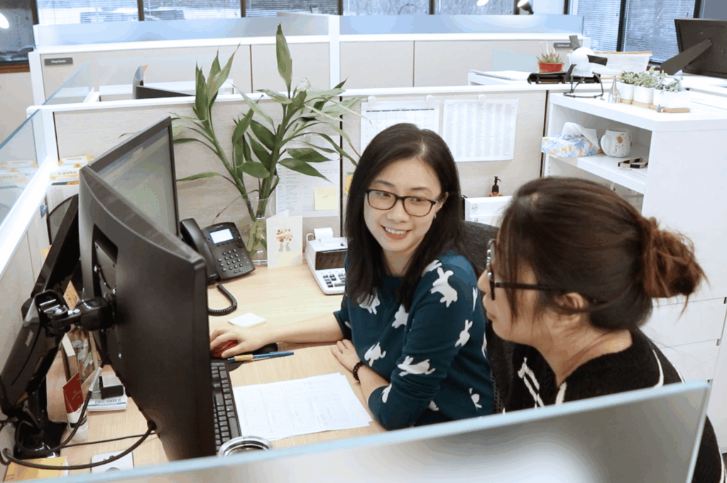 Two female Hajoca employees working together at a desk