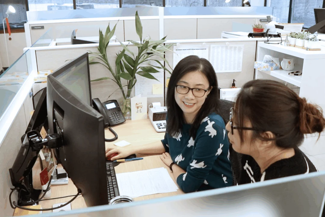 Two female Hajoca employees working together at a desk