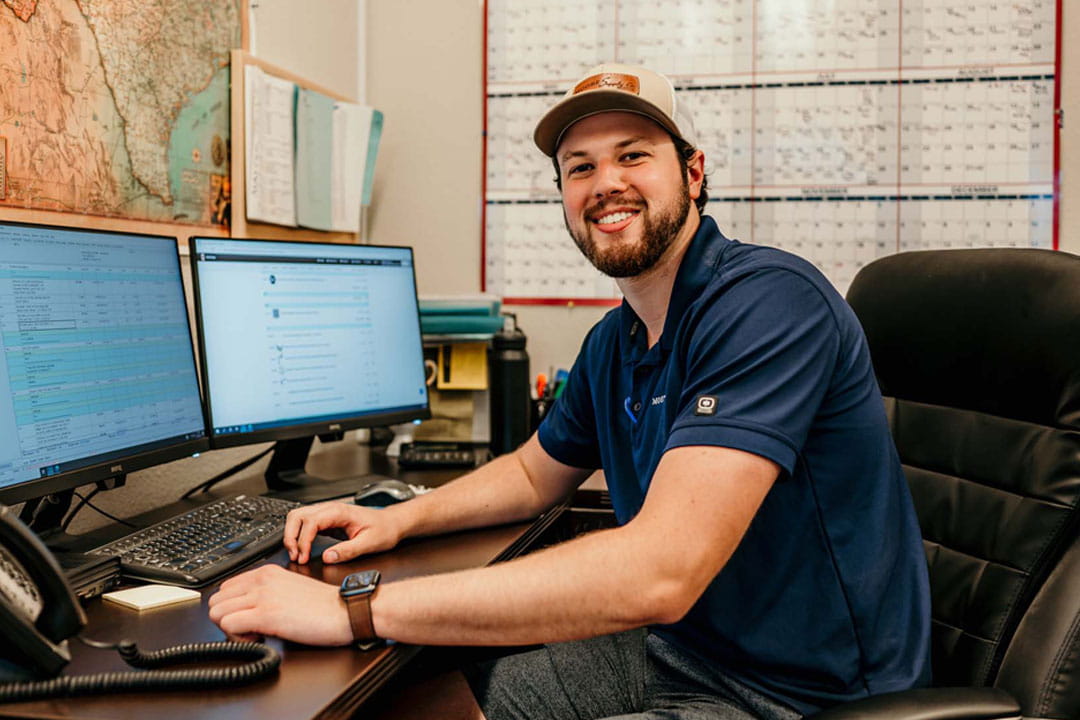 Hajoca leadershipt program participant sitting at a computer